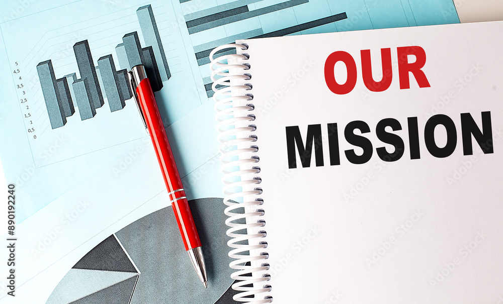 Poster our mission text on notebook on chart background
