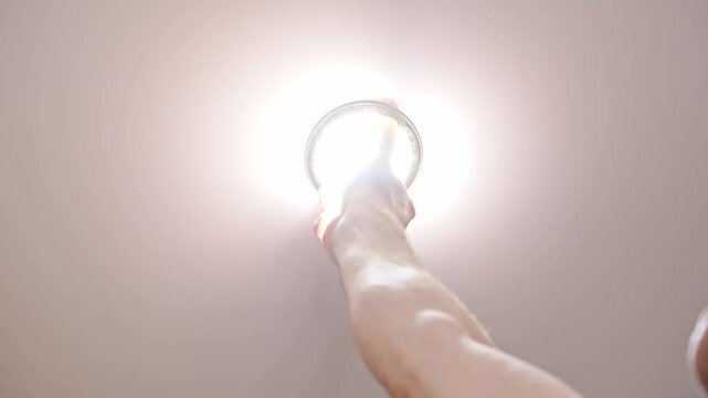 The men will replace the LED bulb in the ceiling lamp. Electrician services and help with household chores.