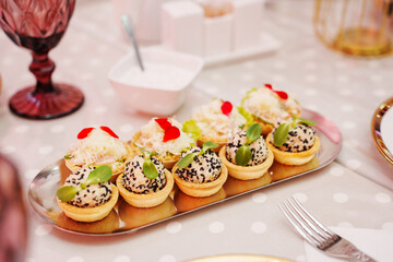 Tartlets with pate decorated with micro greens. Delicious and beautiful appetizers for a buffet table. catering services for banquets.