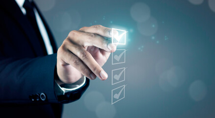 Businessman checking quality assurance QA or QC management, certification Standardization, certification. Compliance to regulations service and standards.