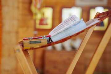 A prayer book with an inscription in Old Russian on the table for the priest at a church service....