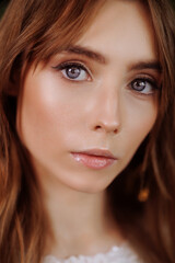 Fototapeta premium Portrait of a young beautiful woman with blue eyes.