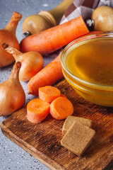 vegetable broth cube on a light stone background