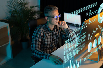 Focused Professional Analyzing Data On Transparent Screen In Modern Office, Representing...
