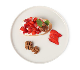 Delicious bruschetta with ricotta cheese, strawberries, mint and walnuts isolated on white, top view