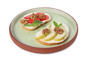 Delicious bruschettas with ricotta cheese, pear, strawberries, mint and walnuts isolated on white