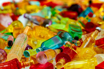 a multitude of miniature resin drink bottles on rotation table