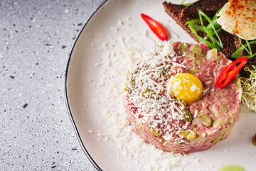 delicious fresh beef tartare on a white plate