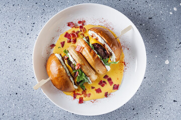 delicious cheeseburger with beef patty in a cheese bath