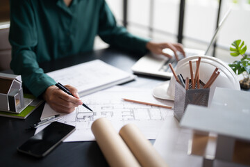 Architects interior designer hands working with Blue prints and documents for a home renovation&nbsp;for house design