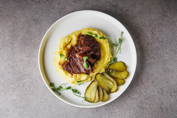 delicious stewed beef cheeks on mashed potatoes