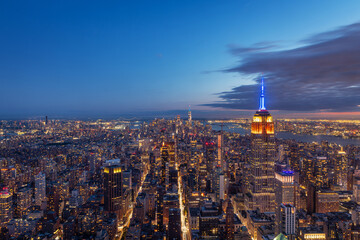 Aerial view of the Empire State Building and downtown Manhattan at dusk, New York City.