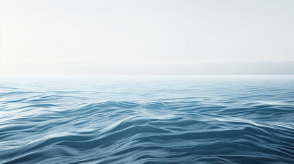 Fototapeta premium Calm blue ocean with gentle waves under a bright, clear sky. The smooth water surface creates a serene and tranquil atmosphere