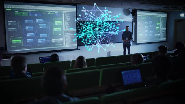 Male Teacher Using Augmented Reality Holographic Visuals to Explain AI Technology, Cloud Computing and Big Data in a High Tech Classroom. Students Engage with Interactive Data on Laptop Computers