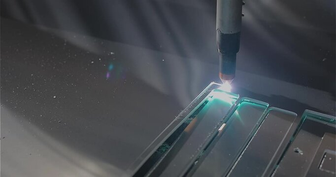 Plasma cutting. Plasma cutter work at the factory. The plasma cutter will cut the part. The process of cutting a metal part with a plasma cutter