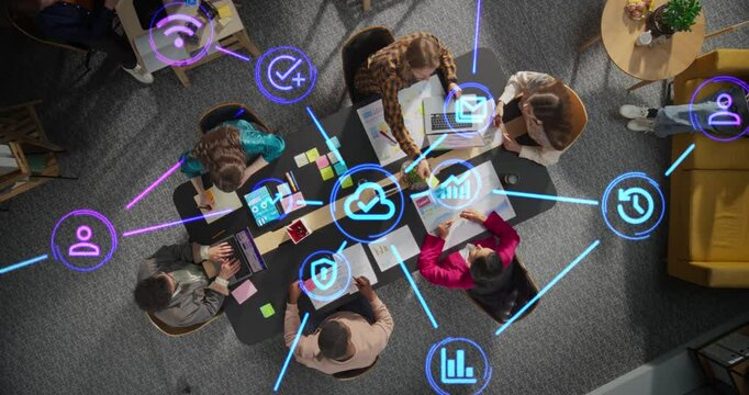 Diverse Team Discussing Internet Software Tools, Online Services and Apps. Top Down Footage with Animated Holographic Icons Representing Cloud Storage, Privacy, Data Protection, Emailing, Reporting - Powered by Adobe
