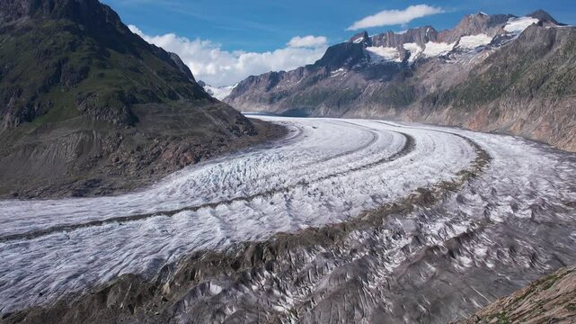 Aerial drone view of Great Aletsch Glacier Alps Switzerland in sunny summer day. Popular tourist destination