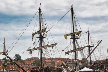 Tall ships docked at a harbor in Whitby, North Yorkshire