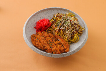 Pork Chop Cutlet with Kansai Fried Noodles served in bowl isolated on background top view of hong kong food