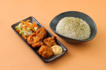 Japanese Fried Chicken with plain rice and mayo dip served in dish isolated on background side view of japanese food