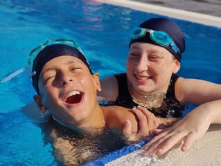 Joyful Youth in the Pool: Embracing Life's Simple Pleasures with a Splash of Happiness. Children swimming in the ness in the pool. 