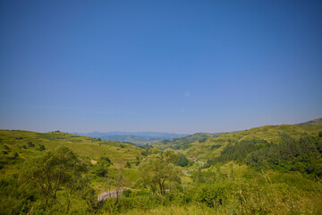Naklejka premium landscape with the rural area in the mountains of Maramures in Romania.