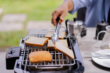 Pieces of white bread are grilling.
