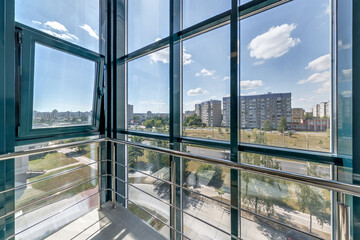 panorama view in empty modern hall with columns, doors and panoramic windows