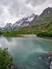 Fototapeta premium Courmayeur, Aosta Valley, Italy - Mont Blanc Massif. Combal lake and plateau, between Italy and France. In the background: Pyramides Calcaires. 