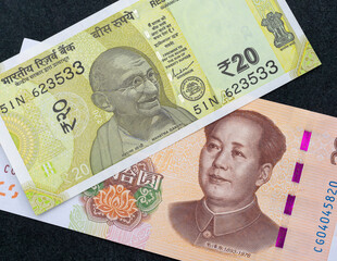 Close-Up of Indian Rupee and Chinese Yuan Banknotes