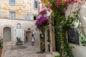 Polignano a mare, white and perched on a cliff overlooking a dream inlet.