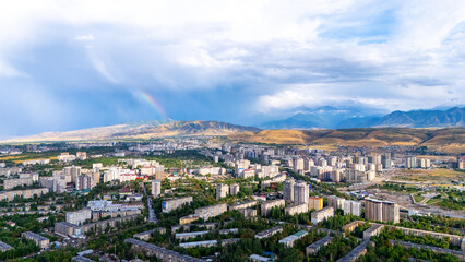 Bishkek panorama with rainbow and mountains