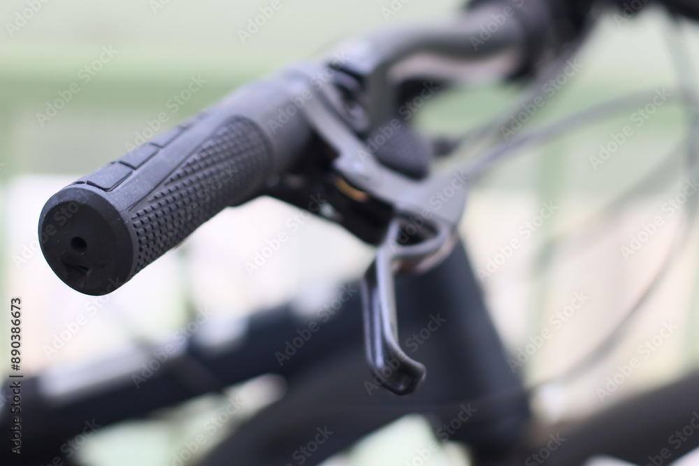 Poster close-up shot of a bicycle handle with intricate details.