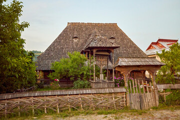 landscape with different traditional houses from Maramures, Romania, Houses built predominantly from wood.