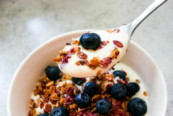 Yoghurt parfait. Breakfast bowl. Yoghurt, blueberries and muesli/granola. 