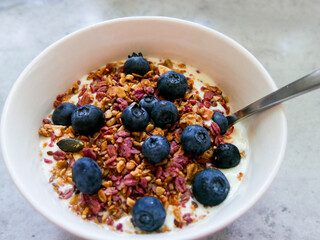 Yoghurt parfait. Breakfast bowl. Yoghurt, blueberries and muesli/granola. 