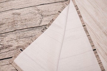 A fabric with a wood-like texture, perfect for use as a backdrop for photoshoots or as a stylish tablecloth. The neutral tones and detailed grain pattern make it versatile for a variety of settings.