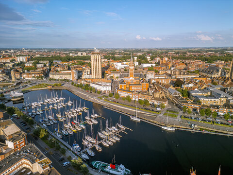  The drone aerial view of Marina Port du Commerce and the tower of the townhall, Dunkirk, France.  Dunkirk is a commune in the department of Nord in northern France. 