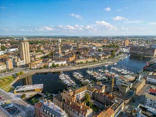 Fototapeta premium The drone aerial view of Marina Port du Commerce and the tower of the townhall, Dunkirk, France. Dunkirk is a commune in the department of Nord in northern France. 
