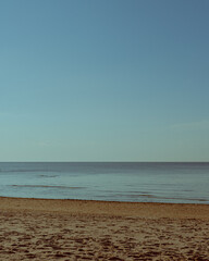 Empty Sandy Beach with Calm Ocean