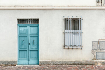 Entrance and window of abandoned house, exterior