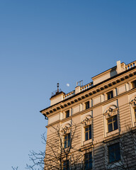 Classic Building Facade with Moon in Sky