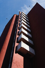 Red Brick Building with White Balconies