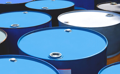 Oil drums group with sunlight on surface in industrial yard area