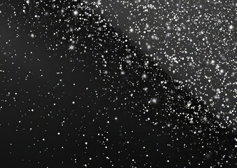 A subtle grain texture. Abstract black and white gritty grunge background. Dark spray paint particles on a paper surface.