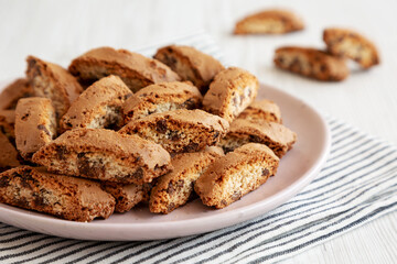 Homemade Cantuccini Cookies with Chocolate Chips on a Plate, low angle view. Close-up.