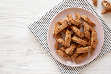 Homemade Cantuccini Cookies with Chocolate Chips on a Plate, top view. Copy space.