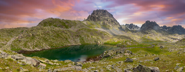 Lakes formed when the snow melted in a spring weather with white clouds in the blue sky. Lakes...
