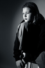 Portrait of a 10 year old girl. A serious portrait of a teenager, a vivid portrait of a growing teenager