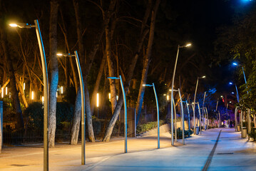 illuminated pedestrian street with modern streetlight and led lanterns at night, Salou, Spain